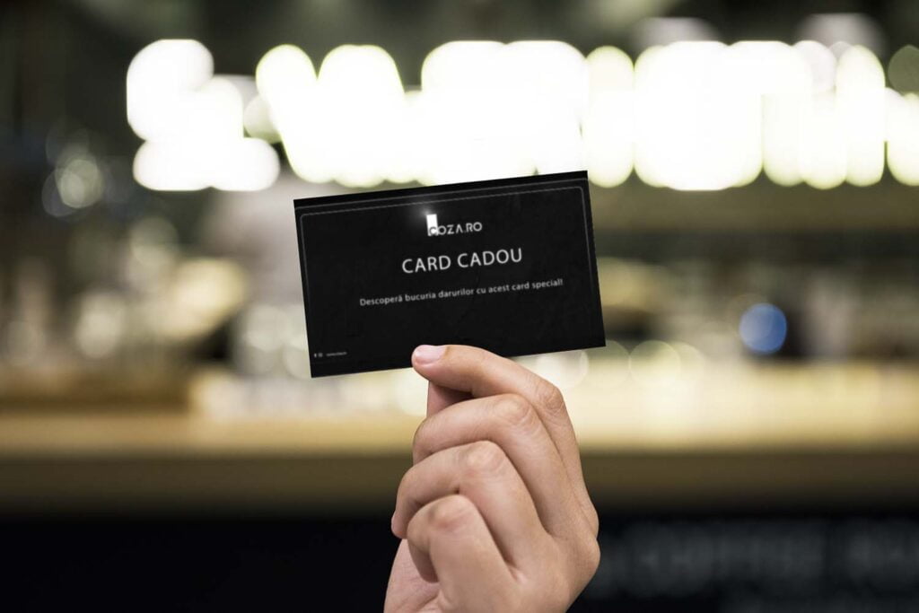 Holding up a business card mockup card cadou butic coza ro